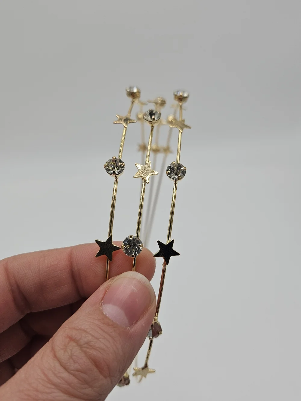 gold tone wire headband with stars and rhinestones